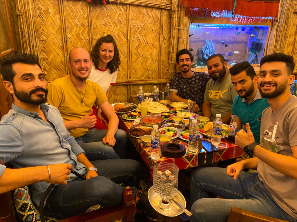 Me, Anna and a group of new friends from the Iraqi Traveller's Cafe eating in Darbunah restaurant in Baghdad.
