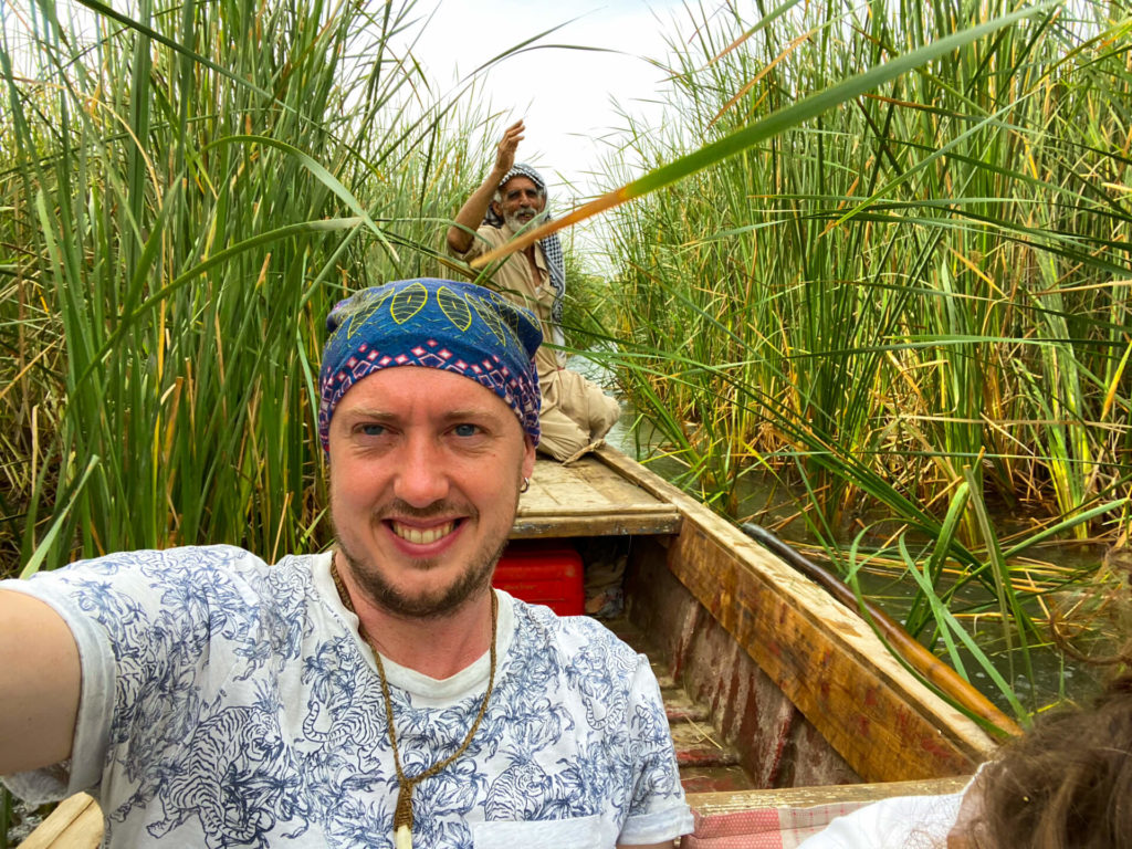 me in a boat travelling through the Mesopotamian marshes.