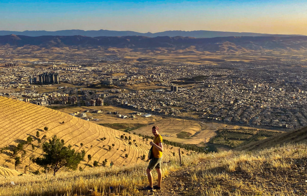 Me standing on Mt. Amzar with Sulaymaniyah in the background at dusk. 